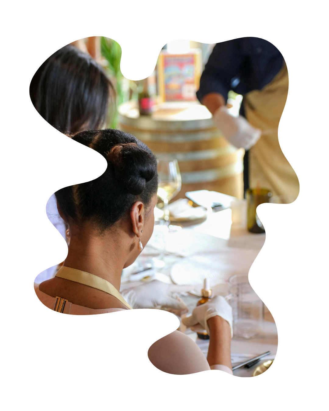Two women sitting at a table with a blurred background
